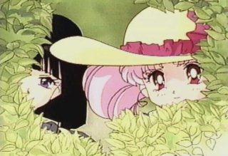 Chibi-Usa and Hotaru peeking out of a bush
